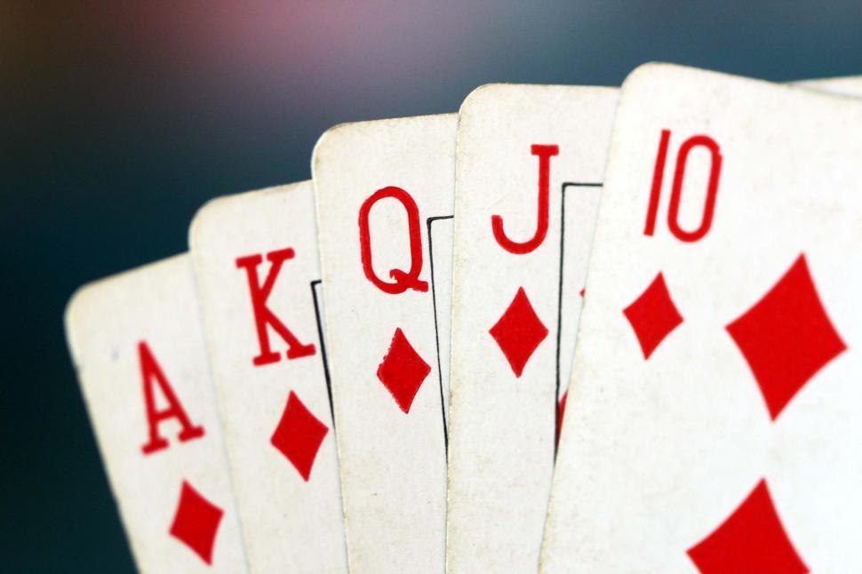Free Image of Four Red and White Playing Cards 