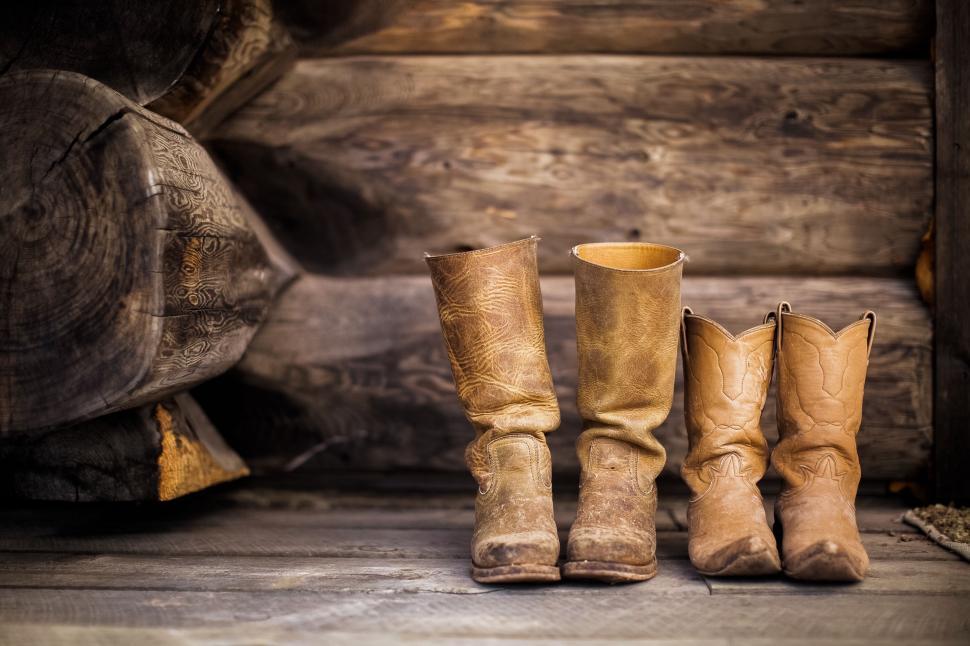 Free Image of Three Pairs of Cowboy Boots Aligned Together 