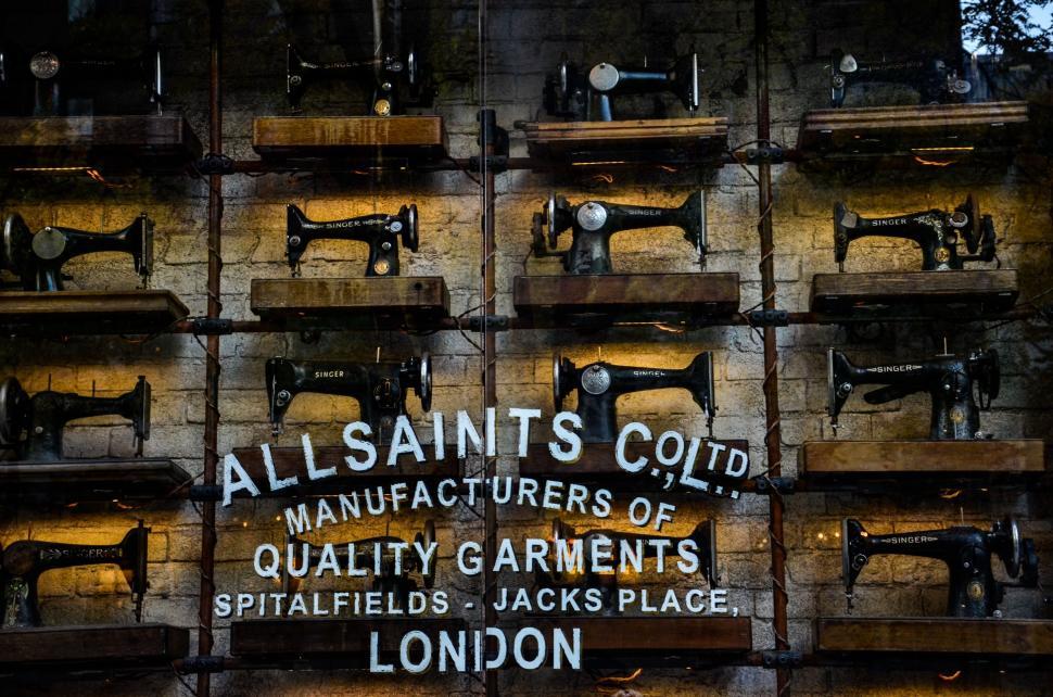 Free Image of Stack of Sewing Machines on Wall 