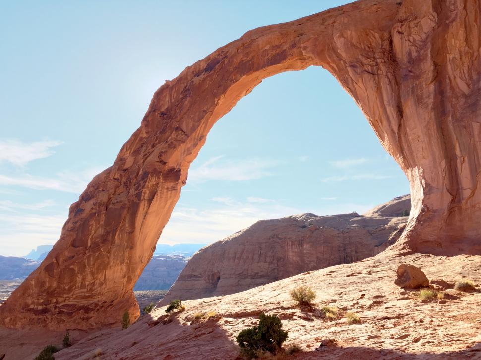 Free Image of Massive Rock Arch in Desert Landscape 