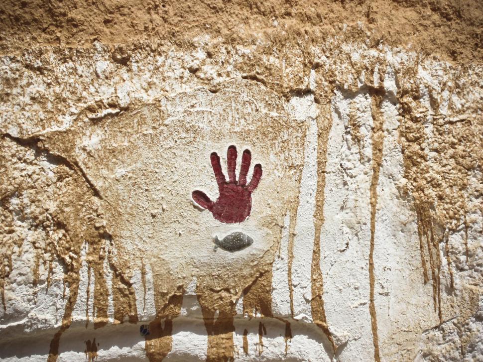 Free Image of Red Hand Print on stone 