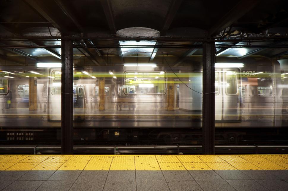 Free Image of Subway Station With Passing Train 