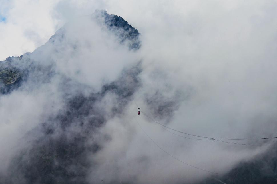 Free Image of Cloud-Covered Mountain With Rope 