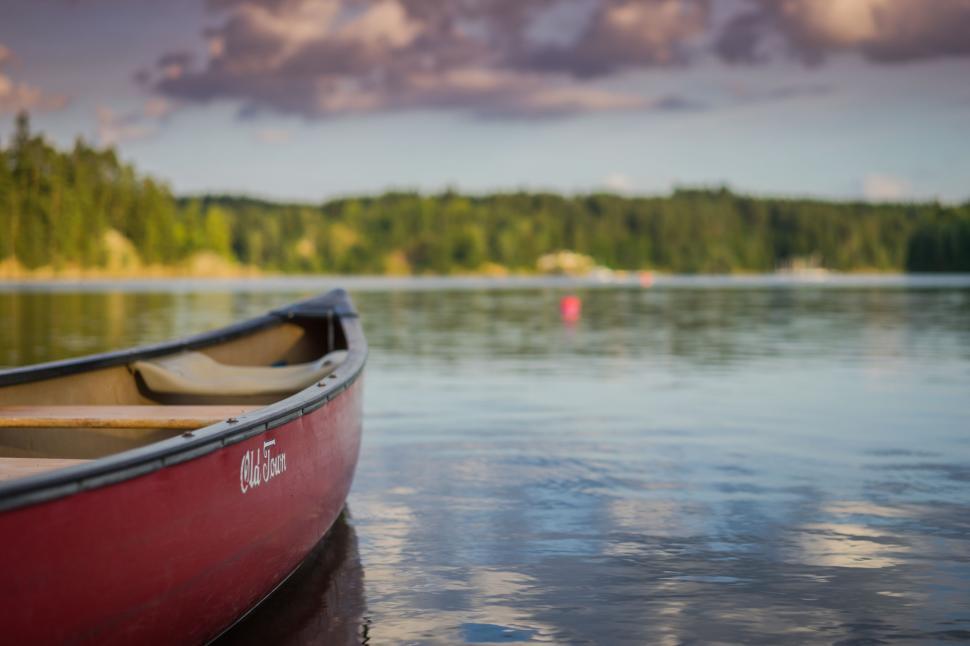 Free Image of Red Boat Floating on Lake 