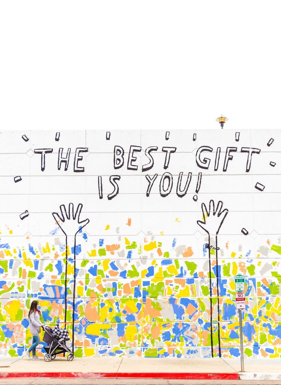 Free Image of A Mural on the Side of a Building That Says the Best Gift Is You 