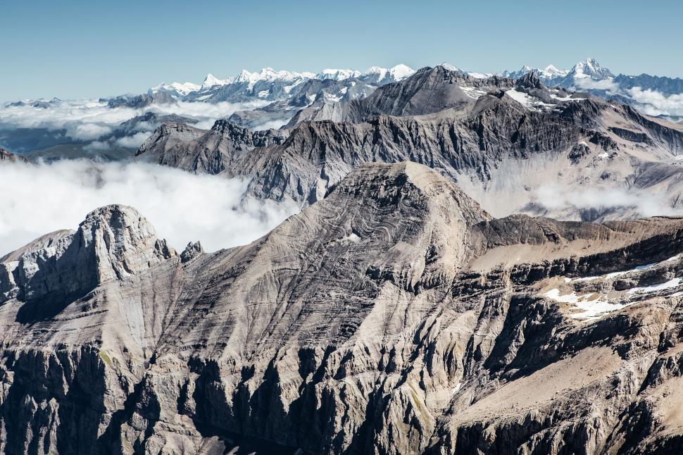 Free Image of A View of a Mountain Range From a Plane 