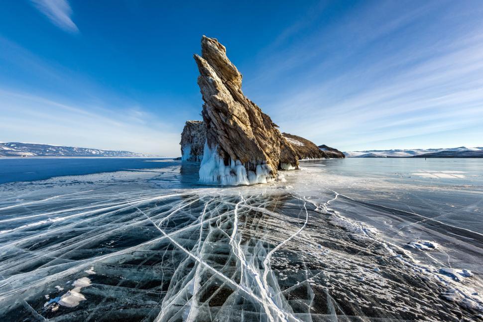 Free Image of Frozen Lake With Large Rock 