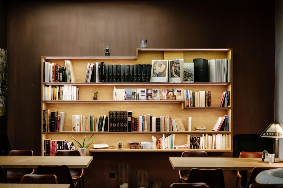 Free Image of Bookshelf Filled With Many Books in a Room 