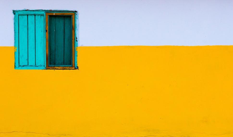 Free Image of Yellow Building With Green Window and Blue Shutter 