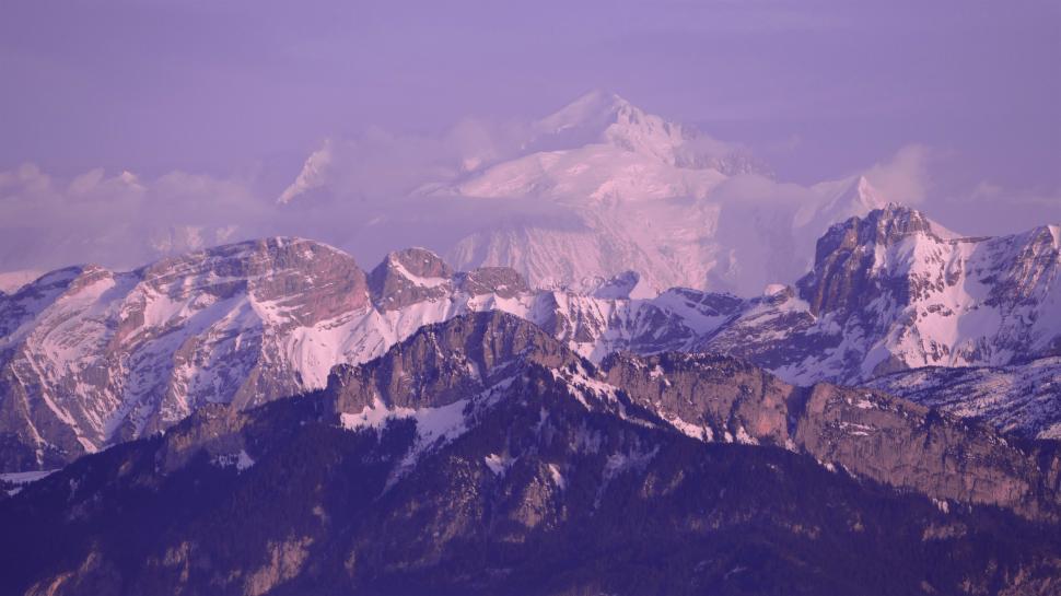 Free Image of Snow-Covered Mountain Range Under Purple Sky 