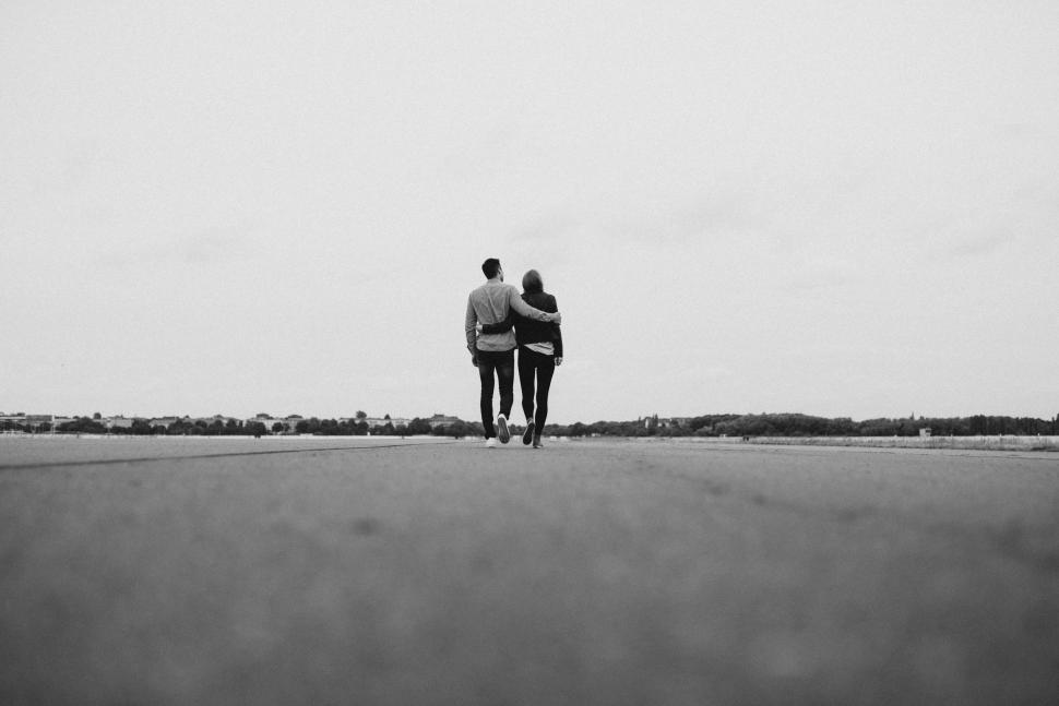 Free Image of Man and Woman Standing in Middle of Road 