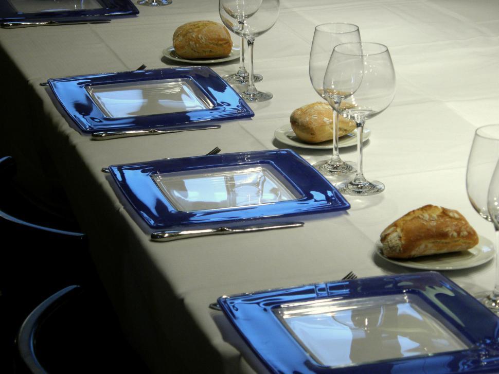 Free Image of Blue plates in place setting 
