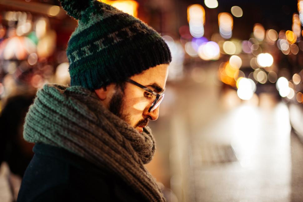 Free Image of Man Wearing Hat and Scarf on City Street 
