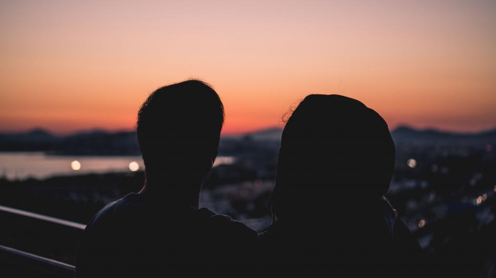 Free Image of Man and Woman Watching Sunset 