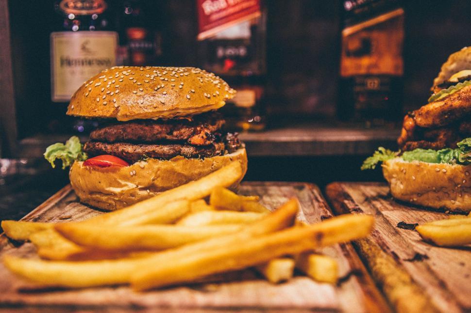 Free Image of Two Hamburgers and French Fries on a Table 