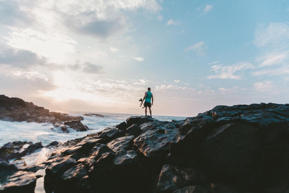 Free Image of Person Standing on Rock Near Ocean 
