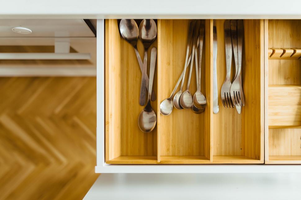Free Image of Organized Cutlery in Wooden Cabinet 