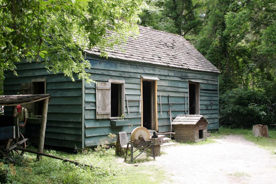 Free Image of Old Blue House in Wooded Area 