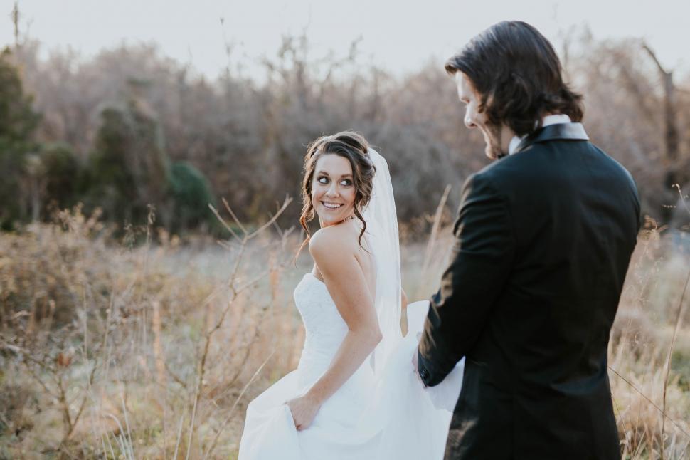Free Image of Bride and Groom Standing in a Field 