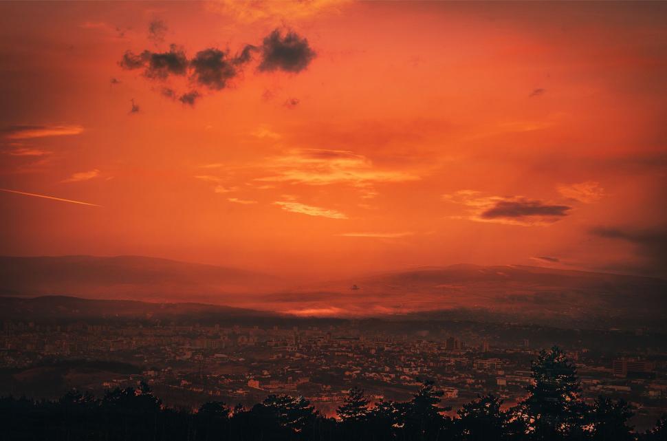 Free Image of The Sun Sets Over the City Horizon 