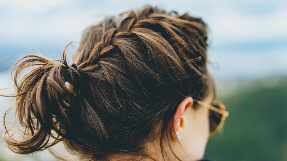 Free Image of Woman With a Messy Bun in Her Hair 