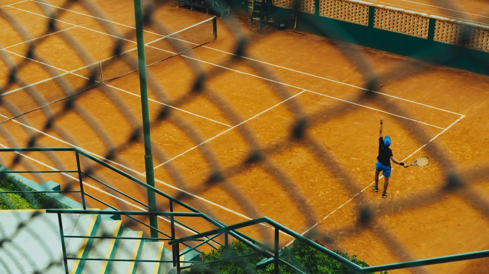 Free Image of Person Playing Tennis on Court 