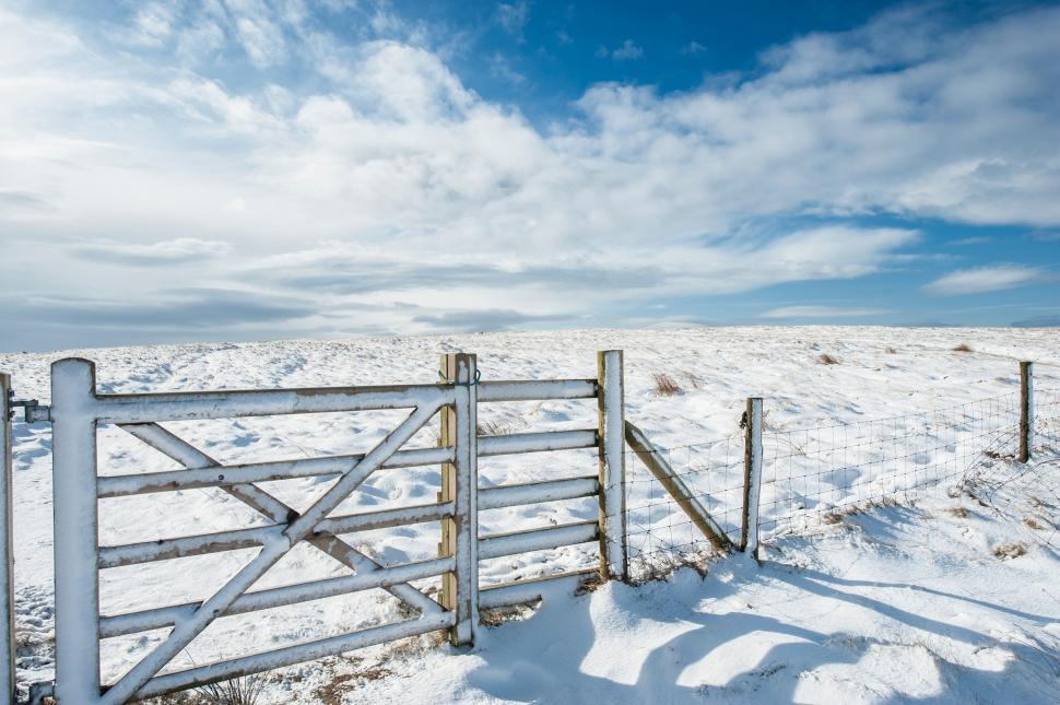 Free Image of A Fence in the Middle of a Snowy Field 