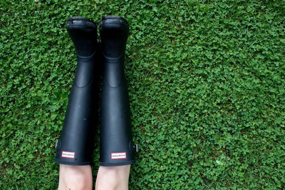 Free Image of Black Boots on Lush Green Field 