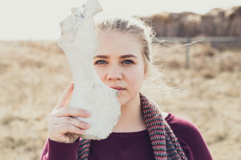 Free Image of Woman Holding Large Rock in Hands 