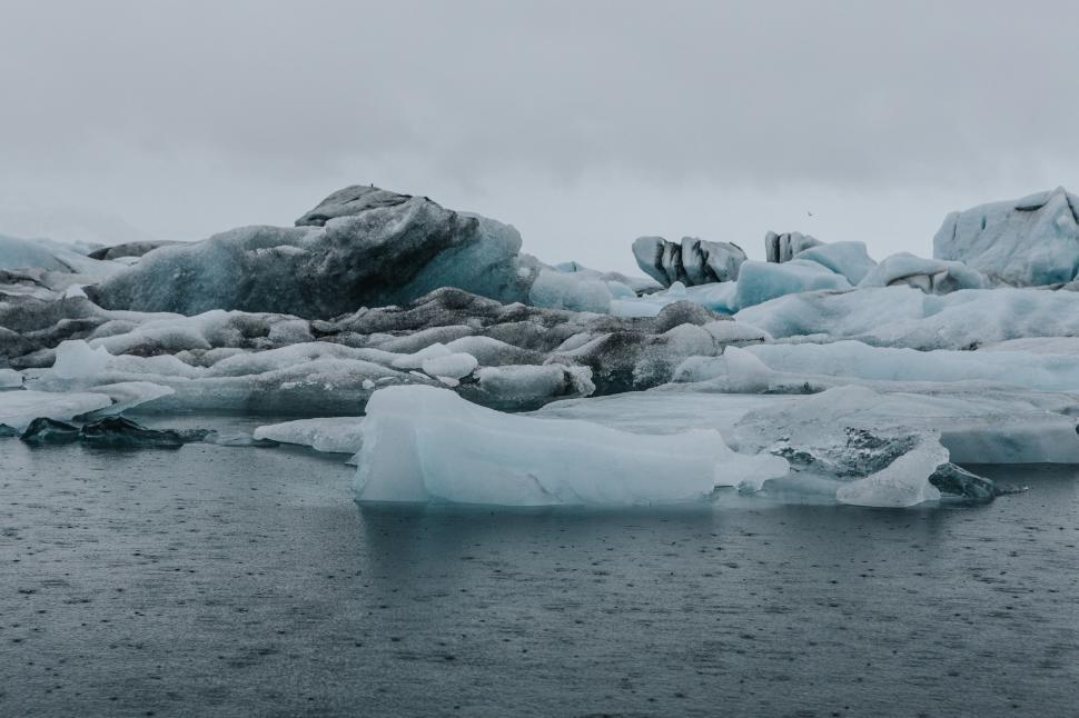 Free Image of Group of Icebergs Floating on a Body of Water 