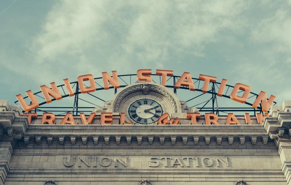 Free Image of Clock on Top of Union Station Sign 