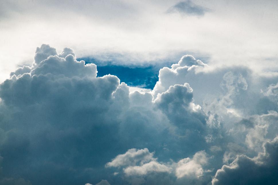 Free Image of A Glimpse of Blue Sky With White Clouds 