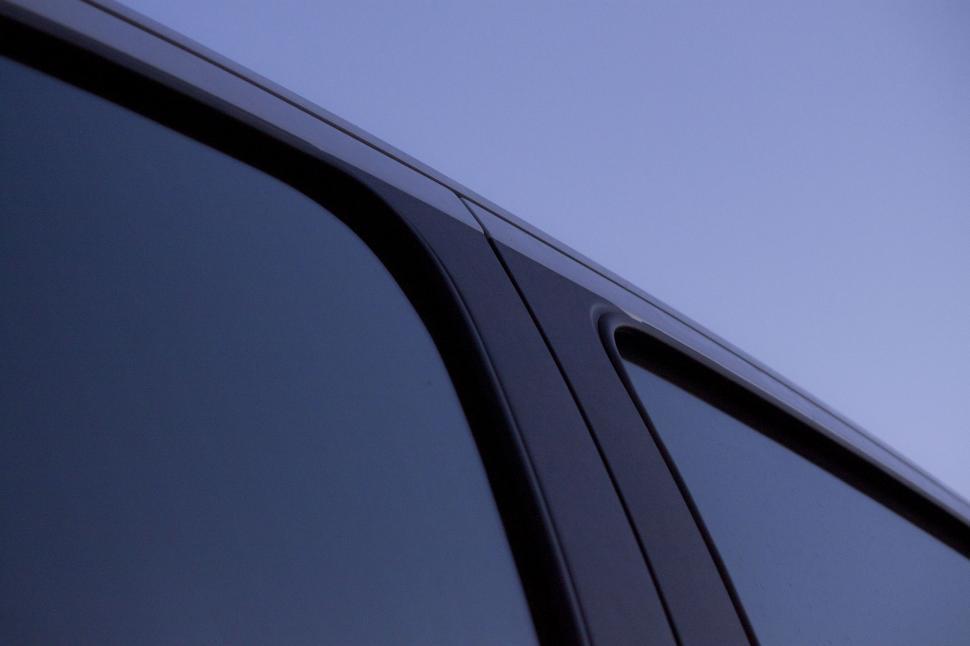 Free Image of Close Up of Car Window With Sky Background 