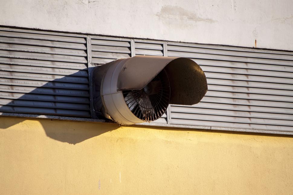 Free Image of Large Fan Installed on the Side of a Building 