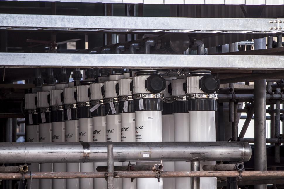 Free Image of Pipes and Valves in a Large Industrial Building 