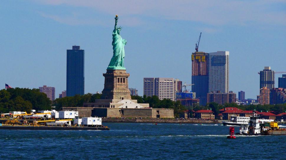 Free Image of Staute of Liberty with city background 