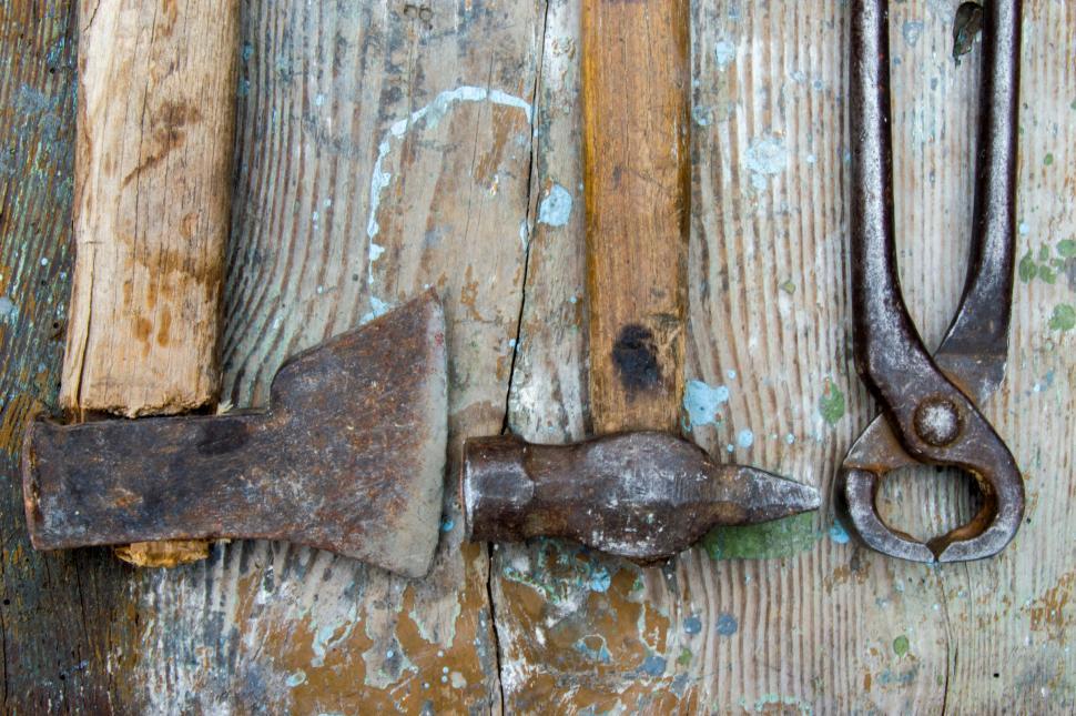 Download Free Stock Photo of Old carpentry tools - a saw, hammer, claw hammer - old wooden table  