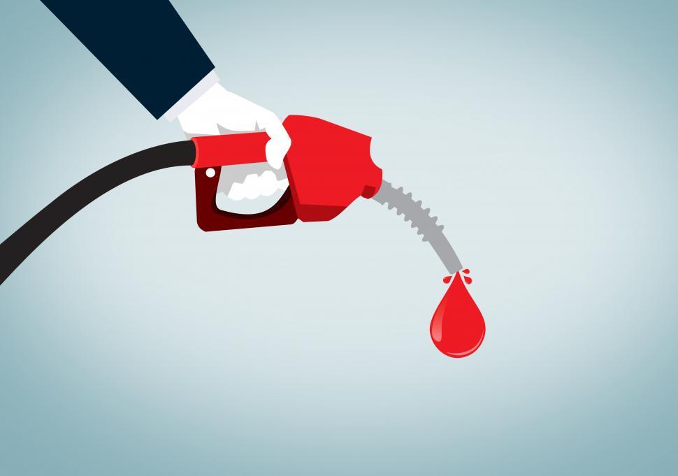 Free Image of Hand Holding Red Nozzle Pumping Gas - Fossil Fuel - Oil and Petr 