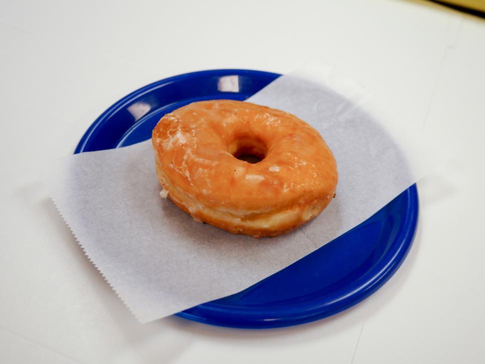 Free Image of Glazed donut on a blue plate 