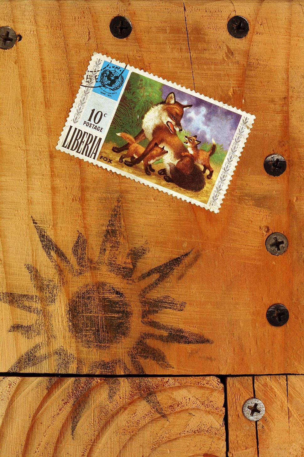Free Image of stamps postage liberia foxes wooden texture sun design grain 