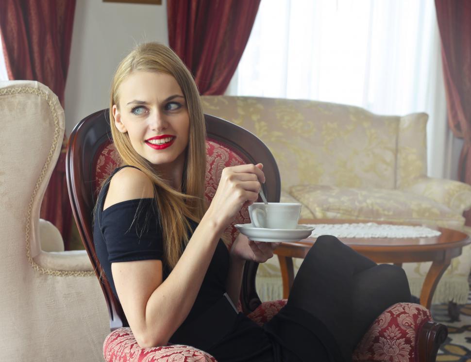 Free Image of Beautiful Young Blonde Woman In Red Lipstick Holding a saucer wh 