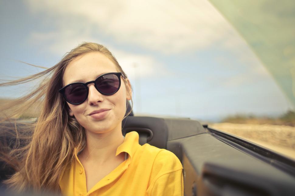Free Image of Young Woman In Sunglasses And Yellow Shirt 