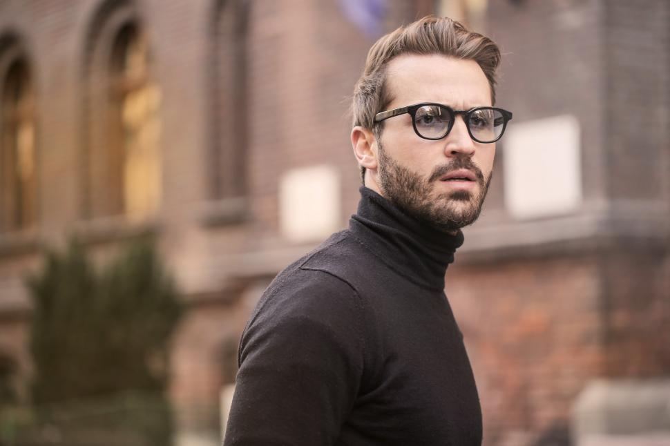 Free Image of Young Adult Man in black turtleneck top posing at the street 