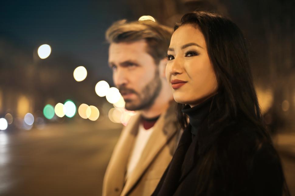 Free Image of Young Adult couple waiting for a cab after dinner date 