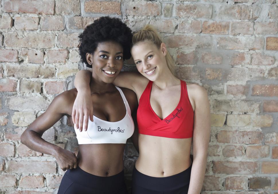 Free Image of Two Young Woman Posing Together In Aerobic Dance Class 