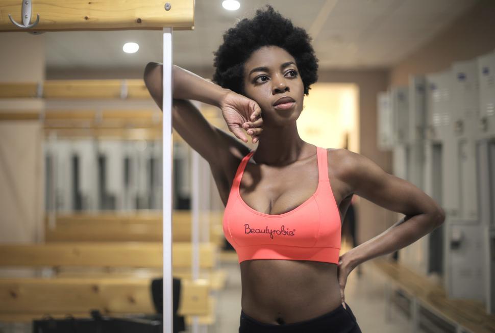 Free Image of Young African Woman in changing room of a gym 