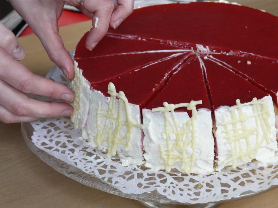 Free Image of Decorating a strawberry-cake 