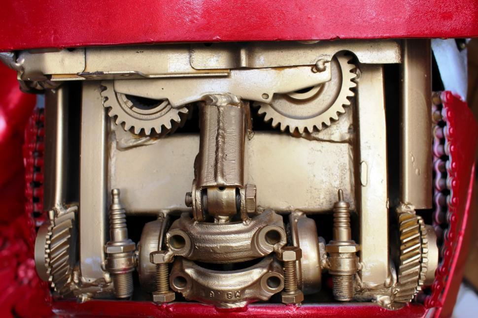 Free Image of Mechanical cogs and gears that look like a robot face  