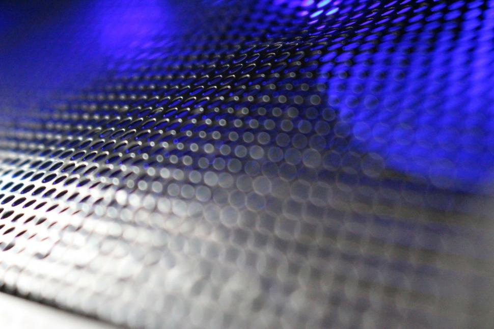 Free Image of Abstract background of metallic mesh with blue 