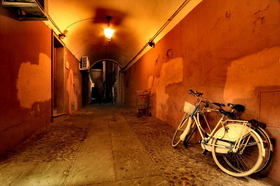 Free Image of Two bicycles parked against the wall 